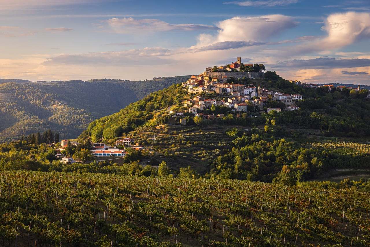 Perched on a hill in Kaštelir-Labinci, Croatia, the stone houses and rolling landscapes create a serene, storybook escape.