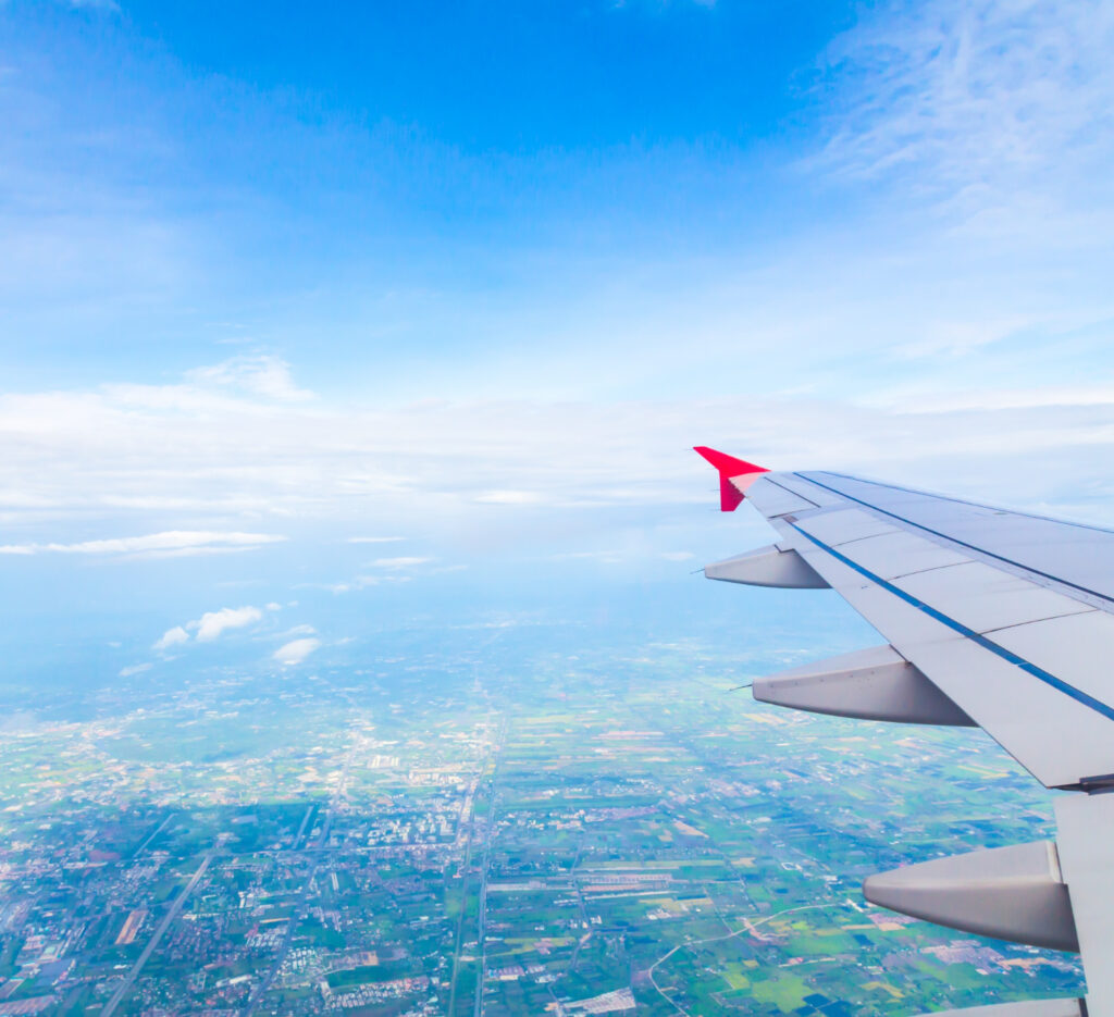 blue sky view from an airplane window seat