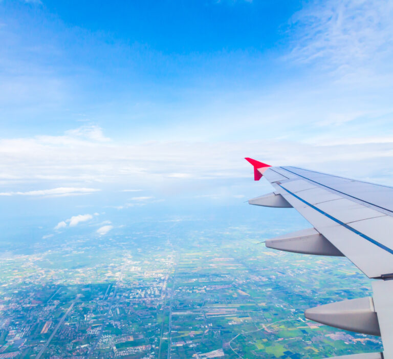 blue sky view from an airplane window seat